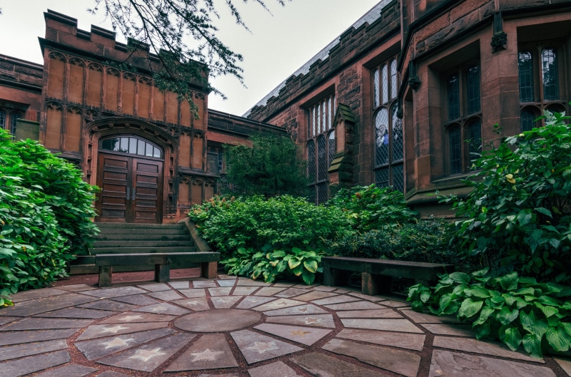 architecture, building exterior, memorial, tree, building, courtyard, house, bench, seat, city, residential district, potted plant, built structure, outdoors