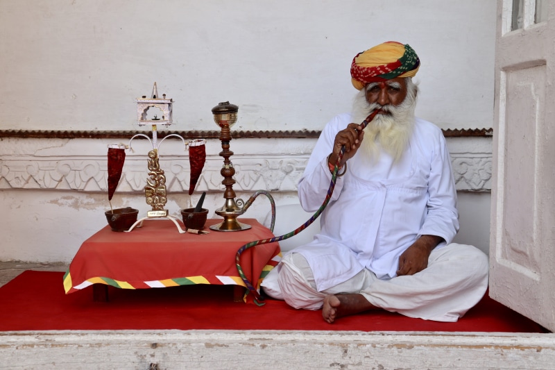 mehrangarh fort, architecture, outdoors, wall - building feature, man, real people, lifestyles, front view, religion, spirituality, one person, full length