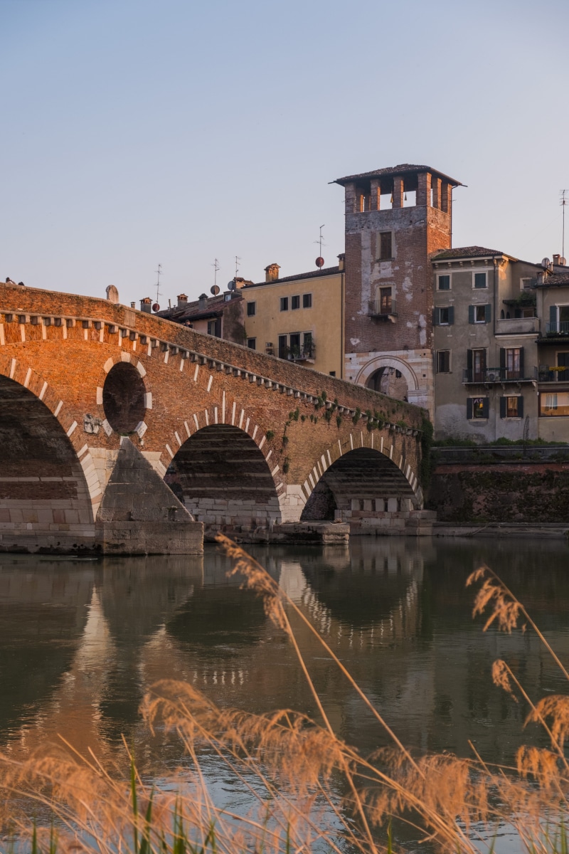 river, no people, golden hour, building exterior, clear sky, built structure, outdoors, sky, building, verona, water, bridge - man made structure, bridge