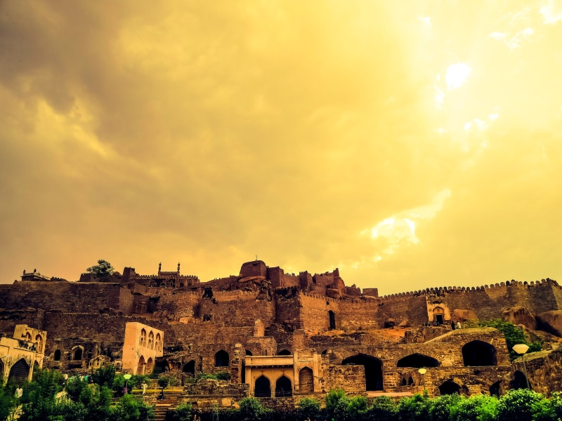 castle, travel destinations, outdoors, ruin, battlement, sunlight, city, ancient civilization, village, travel, hill, indium, daytime, cloud - sky, sky