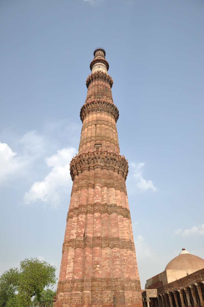 travel, monument, tower, sky, no people, built structure, qutub minar, cloud - sky, tall - high, memorial, low angle view, nature, archaeology, tourism