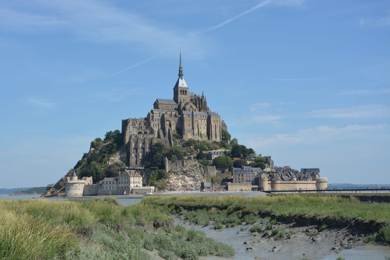 fortification, religion, grass, spire, the past, tourist attraction, old, building exterior, built structure, fortress, blue, historic, monument, gothic