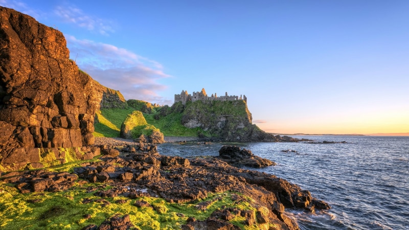 grass, solid, brown, outdoors, no people, rock formation, sunlight, clouds, beauty in nature, ruin, coastal, tranquility, shadow, sky, sandstone, Ireland