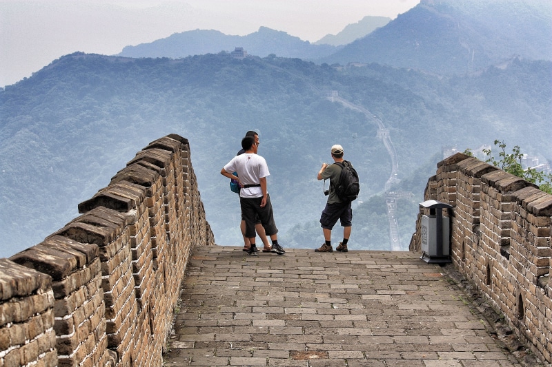wall, casual clothing, ancient civilization, staircase, 4K, real people, men, tourism, asia, built structure, adult, architecture, rear view, leisure activity