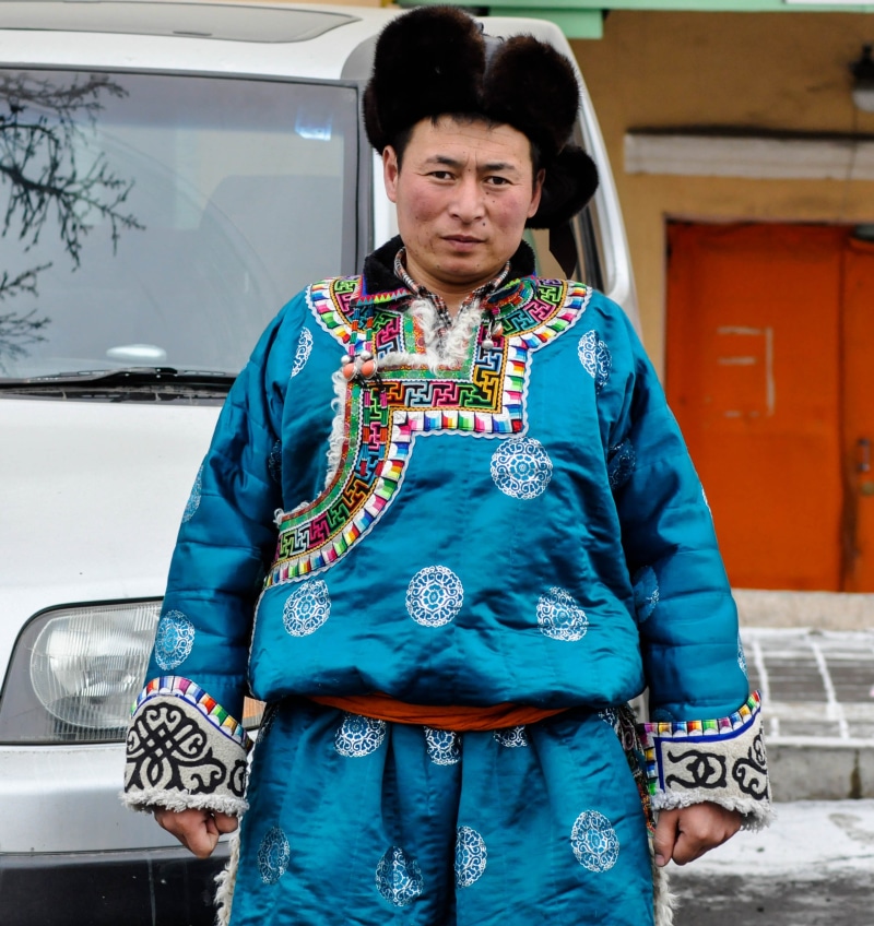 waist up, culture, asian, portrait, hat, male, blue, motor vehicle, leisure activity, lifestyles, ethnicity, mongolia, costume, man, real people, transportation