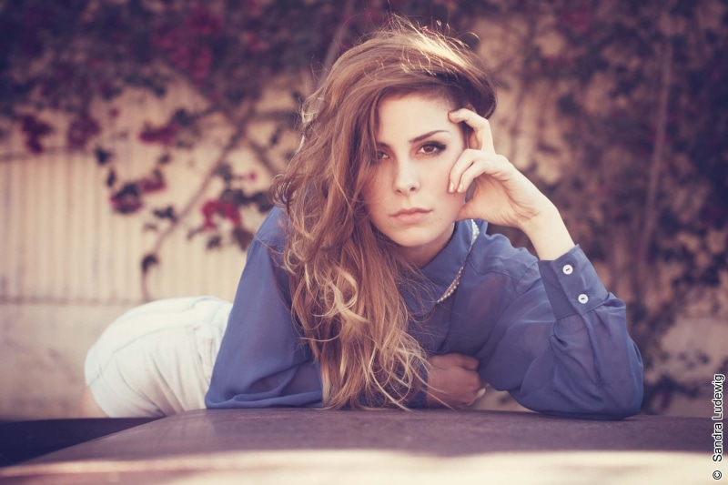 teenager, Lena Meyer-Landrut, hairstyle, outdoors, sitting, celebrity, bent over, front view, long hair, women, 1080P, beauty, brown hair, beautiful woman