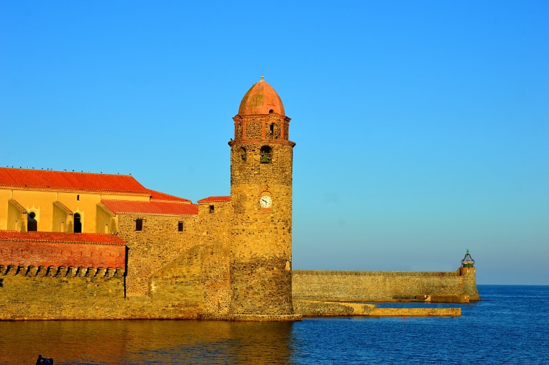 building exterior, sky, sunset, french town, blue, tower, the past, architecture, water, fortified wall, fort, building, church of our lady of the angels