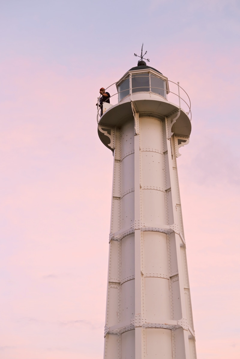 direction, building exterior, white, control tower, built structure, nature, sunset, standing, safety, technology, man, sky, no people, colorful, protection