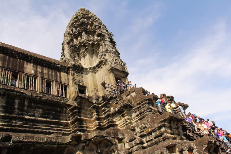 world, lifestyles, angkor wat temple, cambodia, seven wonders, the past, group of people, wonder, cloud - sky, old, day, real people, building exterior