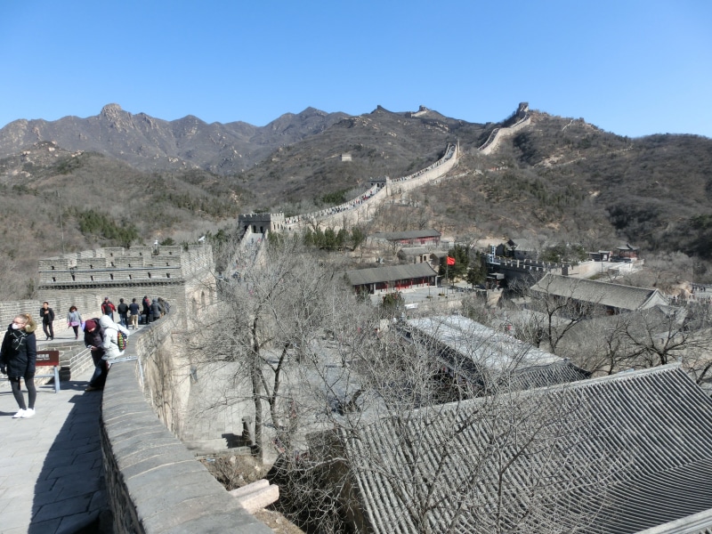 travel destinations, clear sky, real people, landmark, border, landscape, great wall, group of people, tourism, building exterior, places of interest, travel