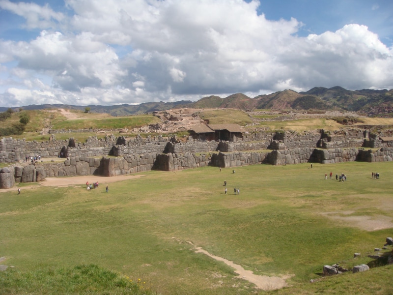 ancient civilization, history, cuzco, old ruin, grass, outdoors, landmark, ruins, sky, travel, culture, ruined, historical, historic, archaeology, built structure