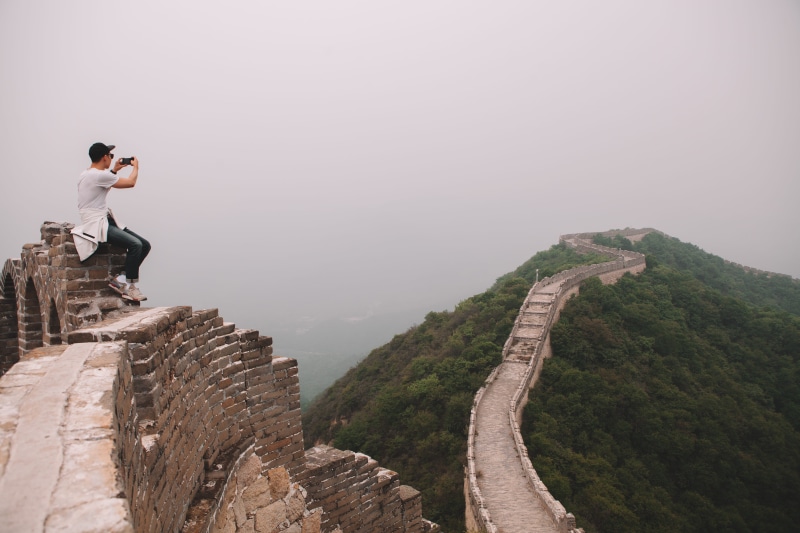young men, day, beijing, rock, sky, roadtrip, china, 5K, side view, one person, looking at view, great wall, fog, chinese, mountain, nature, men, travel
