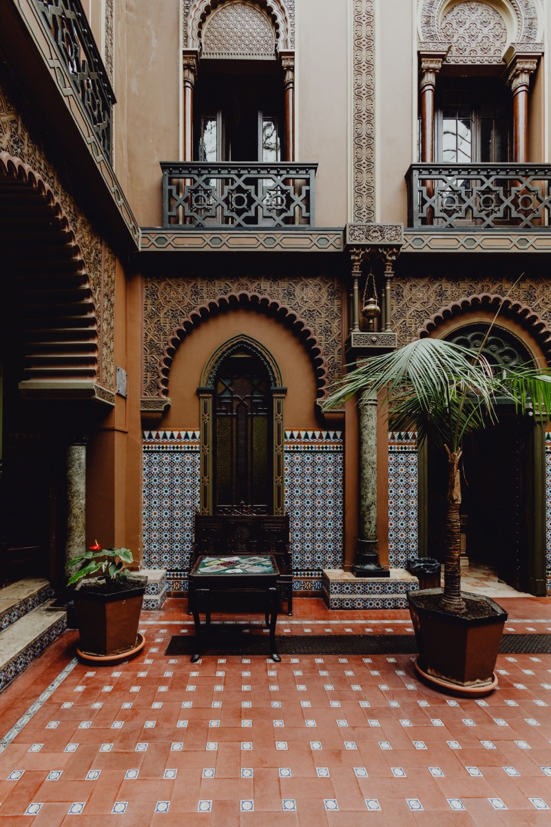 arch, potted plant, spirituality, outdoors, alentejo, building exterior, ornate, restaurant, Moorish-style, entrance, Casa do Alentejo, courtyard, tiled floor
