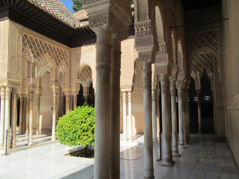 building exterior, religion, fortress, castle, courtyard, alhambra, tourism, colonnade, arcade, building, nature, corridor, day, sunlight, tiled floor