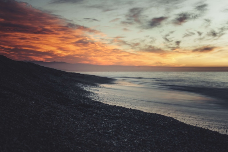 sunset, sunrise, land, wave, idyllic, rock, orange color, cloud - sky, sea, beauty in nature, andalusia, beach, 2K, horizon, motion, water, sky, tranquility