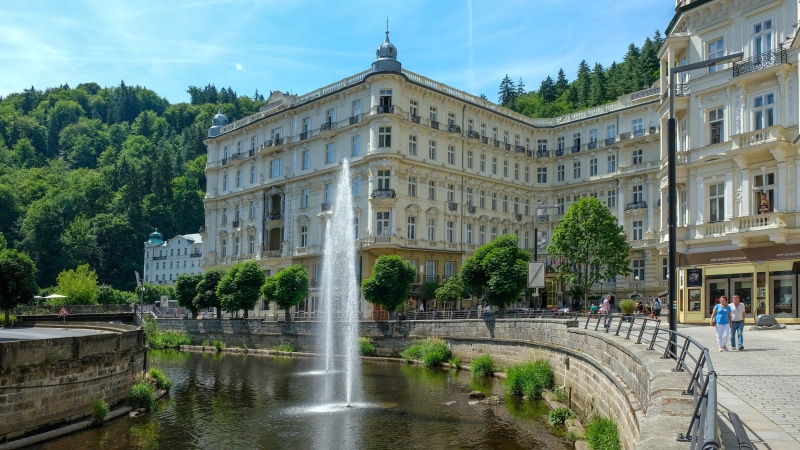 built structure, day, old town, travel destinations, real people, building, canal, fountain, nature, water, 5K, large group of people, women, tree, building exterior