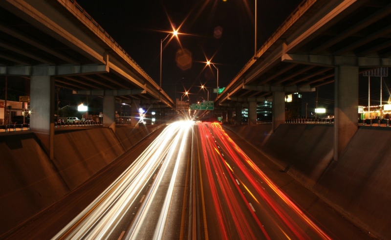 outdoors, 1080P, blurred motion, city life, speed, building exterior, traffic, no people, photography, street light, multiple lane highway, vehicle light