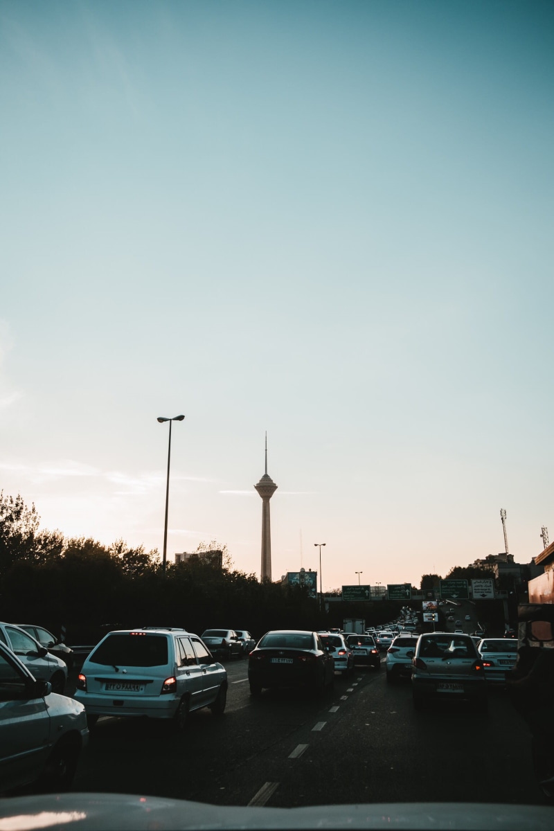 building exterior, street, outdoors, travel, clear sky, road, street light, architecture, city, mode of transportation, land vehicle, nature, traffic, iran