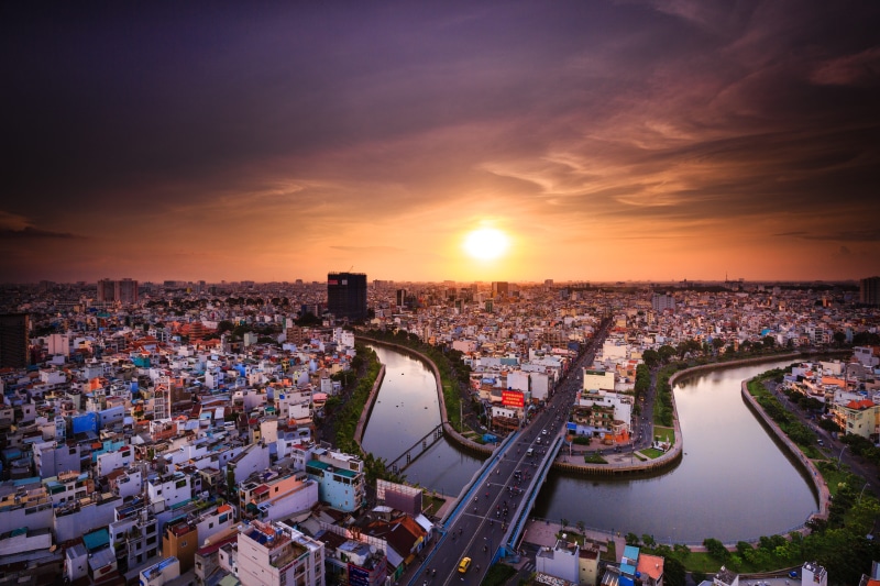 business, high angle view, crowd, cloud - sky, building exterior, skyscraper, illuminated, outdoors, traffic, sai gon, nice, built structure, evening, asia