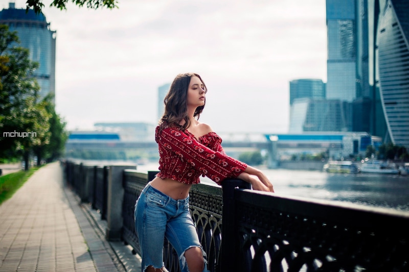 hair, one person, closed eyes, torn jeans, standing, hairstyle, Moscow, outdoors, leisure activity, long hair, beautiful woman, women outdoors, adult, cityscape