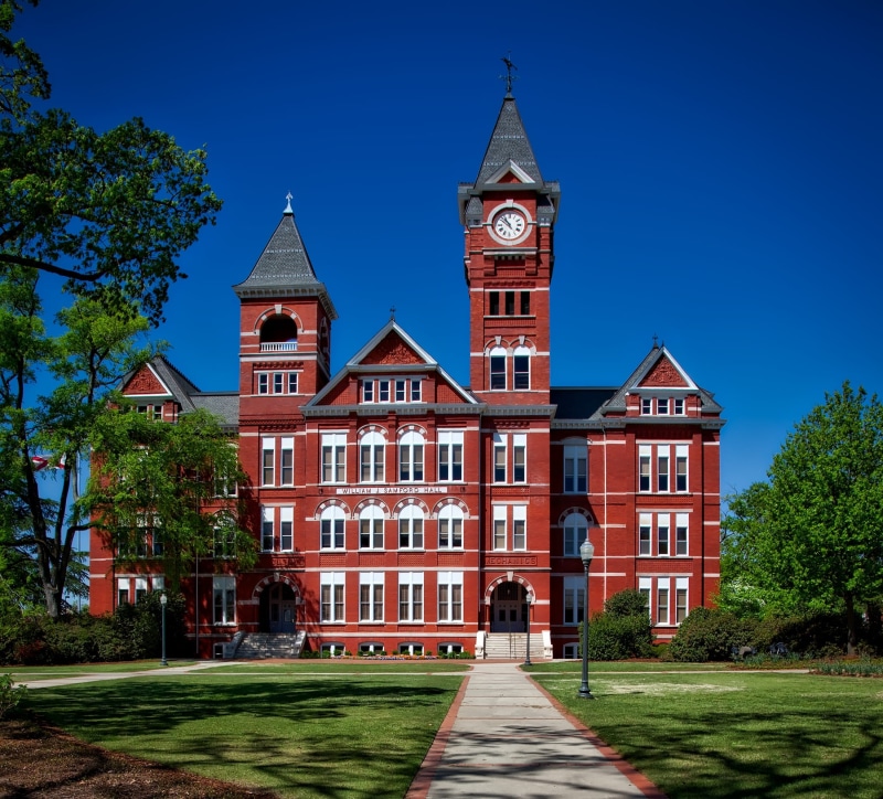 house, built structure, history, residential district, red, campus, clock, blue, day, auburn university, lawn, building, sky, school, architecture, tree