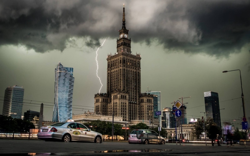clock tower, office building exterior, concrete, city life, motor vehicle, city, outdoors, Poland, tower, clouds, built structure, architecture, lightning