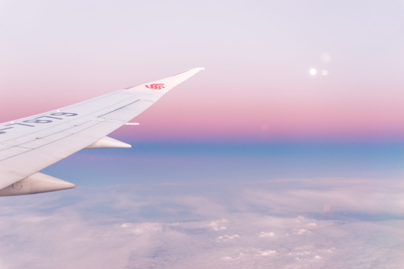 clouds, blue, cloudscape, sunrise, sunset, no people, outdoors, flying, travel, baby pink, mid-air, high, nature, scenics - nature, aircraft wing, above