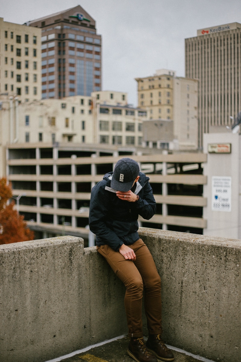 fashion, one man only, retaining wall, man, establishment, real people, photography themes, condominium, men, obscured face, built structure, one person
