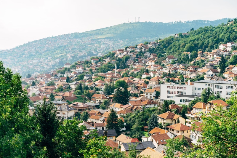 view, built structure, postcard, bijela tabija, mountain, building exterior, outdoors, tree, residential area, high angle view, townscape, mountainous landforms
