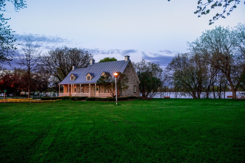 sky, building exterior, no people, dawn, field, day, dusk, environment, lawn, building, outdoors, clouds, architecture, trees, tree, yard, porch, nature