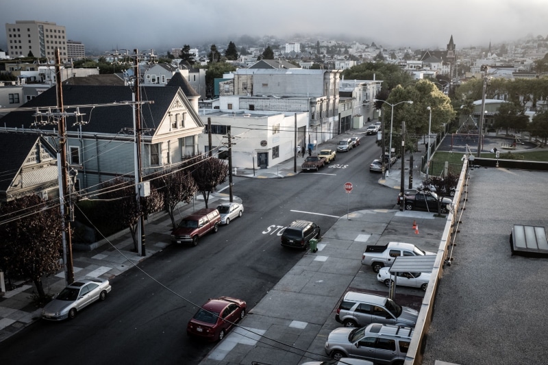 cloudy, building, motor vehicle, outdoors, cityscape, multiple lane highway, 1080P, car, architecture, no people, concrete, land vehicle, day, town, street