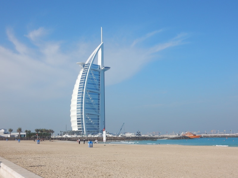 dubai, transportation, burj, built structure, architecture, mode of transportation, sand, day, incidental people, beach, sailboat, sky, 2K, tourism, nautical vessel