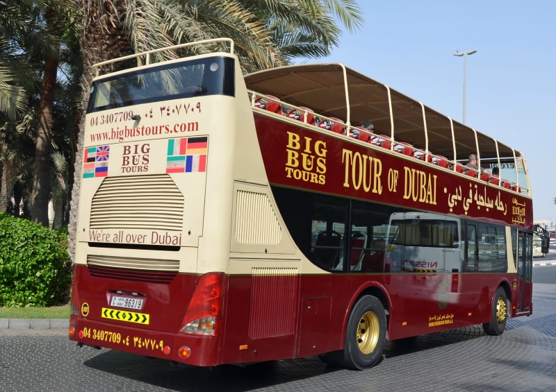 street, land vehicle, sign, number, dubai, desert, tour, sun, communication, day, nature, no people, sea, architecture, tourists, transportation, city tour