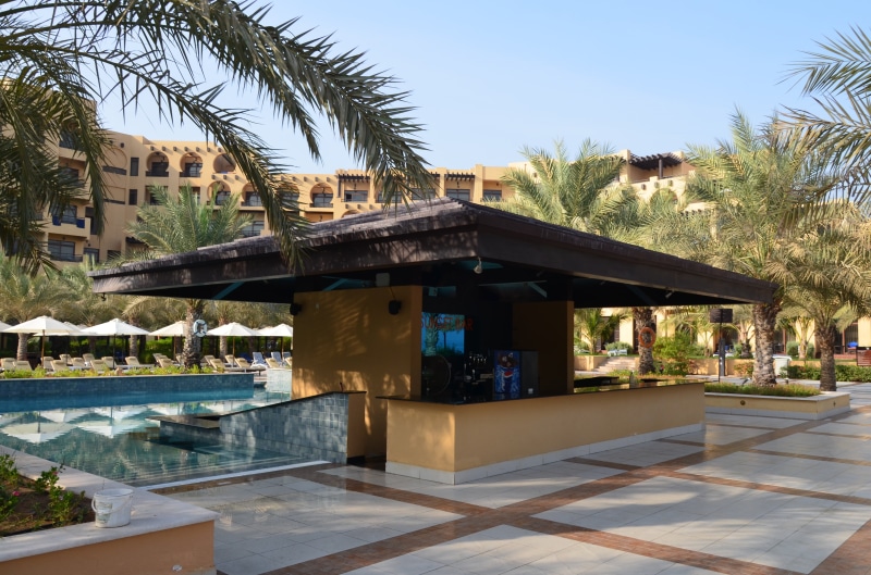 hotel, tropical climate, built structure, tourist resort, travel destinations, clear sky, tiled floor, plant, day, water, swimming pool, architecture, u a e