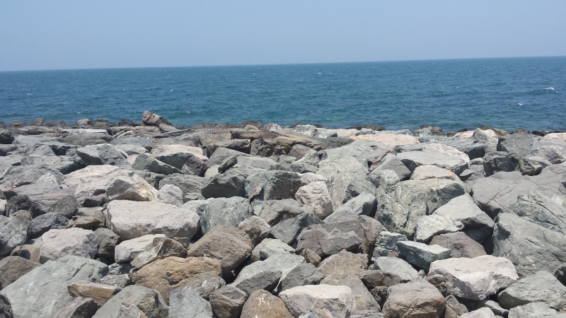 beauty in nature, rock, persian gulf, solid, emirates, clear sky, beach, tranquil scene, tourism, rock - object, horizon over water, no people, land, sea