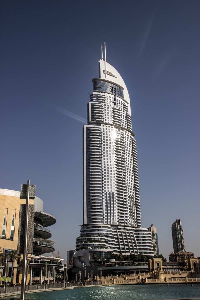 city, building, tall - high, travel, no people, u a e, day, water, modern, clear sky, office building exterior, travel destinations, low angle view, dubai