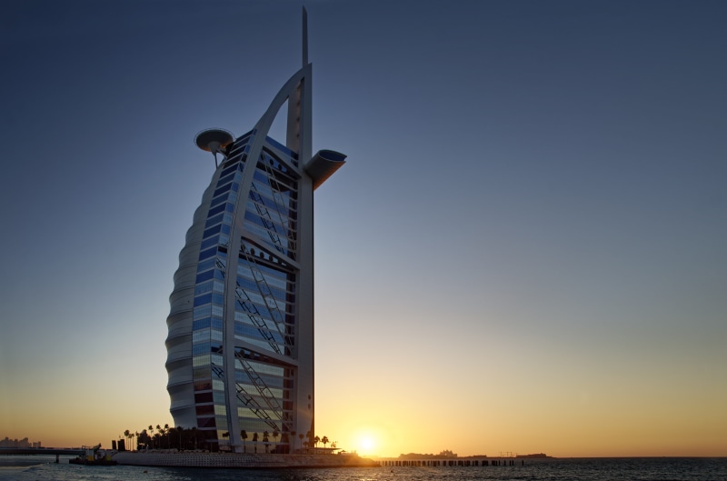 office building exterior, the sky in the evening, building, no people, tower, sunset, u a e, 8K, tall - high, beach, sea, beauty in nature, travel destinations