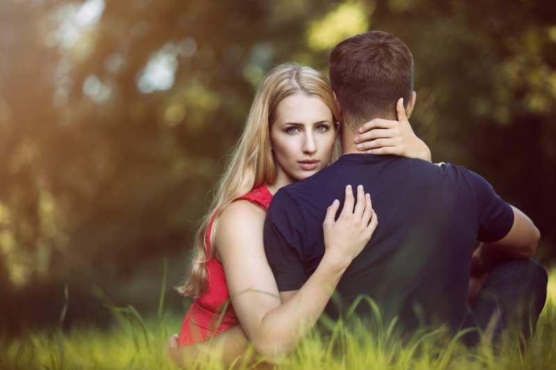 embracing, men, pair, relationship, young adult, young couple, romantic, grass, affair, two people, young women, jealous, adult, bonding, blur, couple