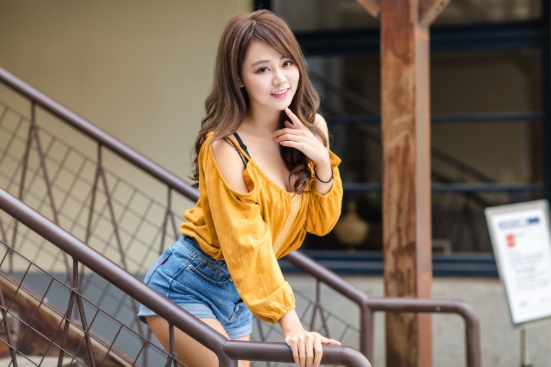 women, hairstyle, front view, smiling, young women, one person, young adult, yellow, portrait, hot pants, real people, leisure activity, casual clothing