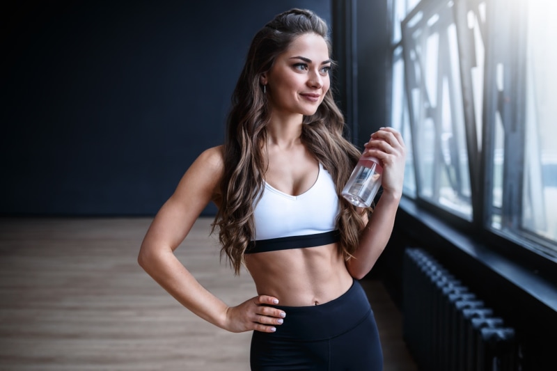 young women, young adult, standing, smiling, fitness model, front view, beauty, model, 1080P, sports clothing, clothing, sport, indoors, long hair, three quarter length