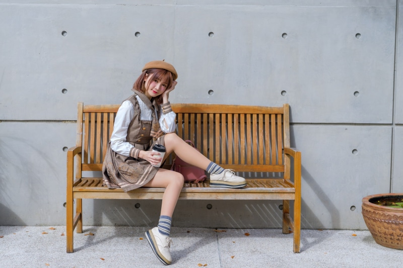 dress, outdoors, berets, socks, women, portrait, bench, women outdoors, brunette, model, shoes, backpacks, shirt, wall, looking at viewer, sitting, Asian