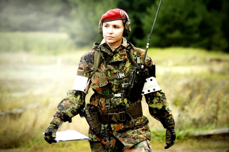 tree, red, nature, soldier, beret, uniforms, military, girl, weapon, front view, one person, portrait, work helmet, forest, day, army helmet, suit of armor