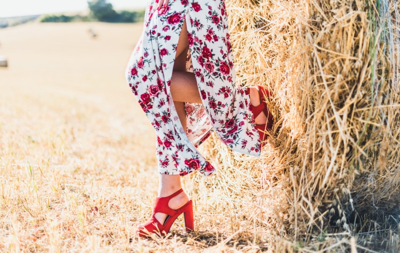 field, hay, sunlight, agriculture, nature, woman, straw, floral pattern, land, girl, red flower, bale, leisure activity, one person, lifestyles, grass