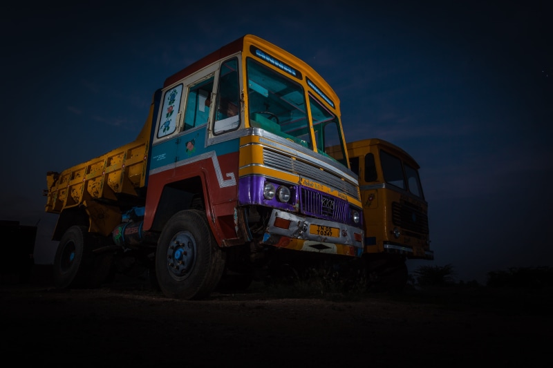 motor vehicle, transportation, commercial land vehicle, tamil nadu, illuminated, stationary, outdoors, low angle view, semi-truck, school bus, india, stars