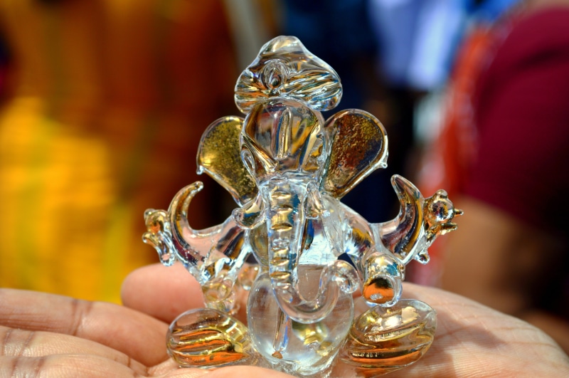 one animal, india, holding, close-up, glass, tamil nadu, figurine, body part, finger, luxury, decor, unrecognizable person, religion, clear, spirituality