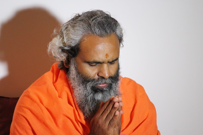 orange, orange color, front view, meditation, closing, facial hair, mustache, one man only, studio shot, india, Hindu, adult, tradition, portrait, gray
