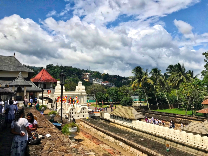 sky, temple, track, cloud - sky, day, tree, group of people, architecture, real people, rail transportation, nature, plant, adult, built structure, transportation