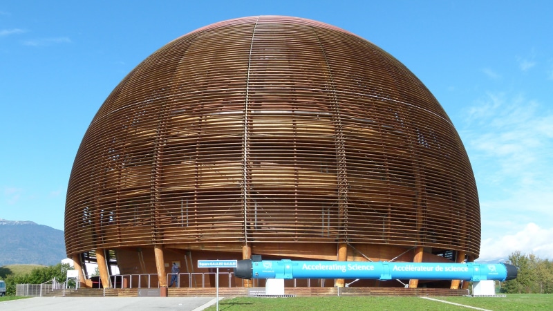 wooden dome, Switzerland, skyscraper, day, clear sky, low angle view, domed roof, cloud - sky, blue, built structure, brown, reflection, travel, nature