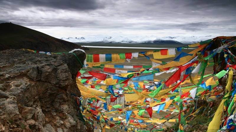 landscape, mountain, cloud - sky, cold temperature, scenics - nature, outdoors, flag, damxung, buddhist, environment, day, namco, mountain peak, beauty in nature