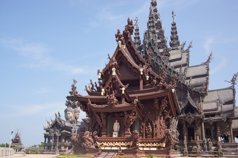 religious, building exterior, outdoors, the past, day, sculpture, nature, wooden, pattaya, sky, religion, architecture, history, shrine, temple, travel destinations